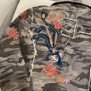 Women's Camouflage Utility Jacket with embroidered detail on left arm and back